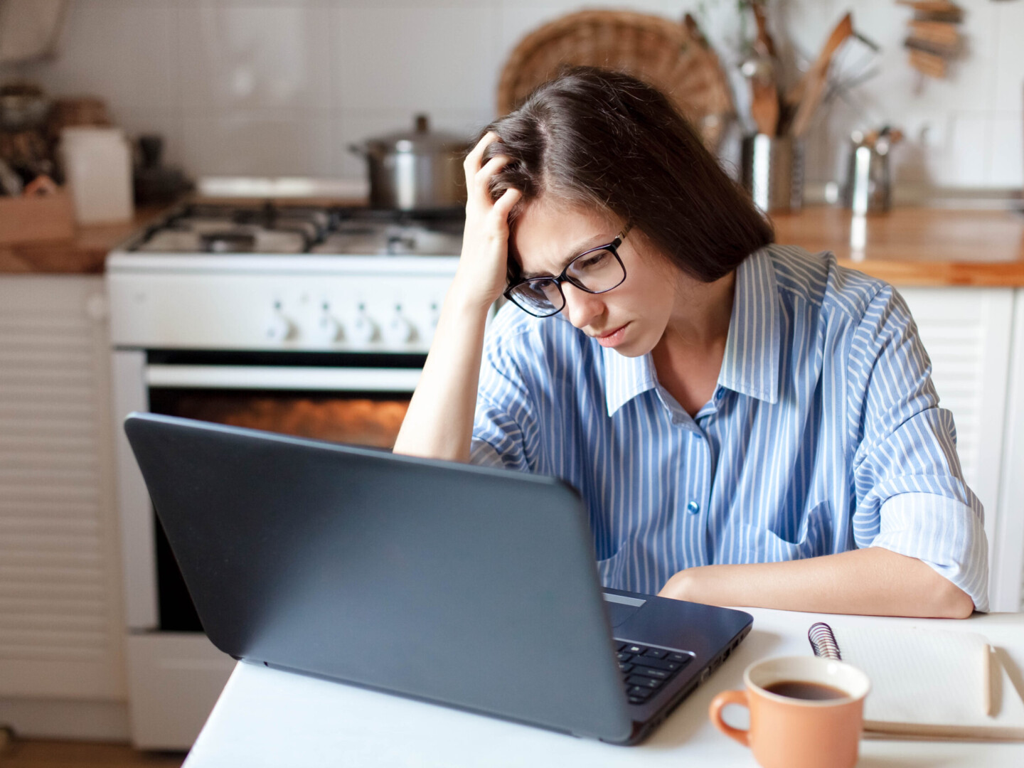Upset woman working from home office as hero image for article about mental Health Awareness Week 2023