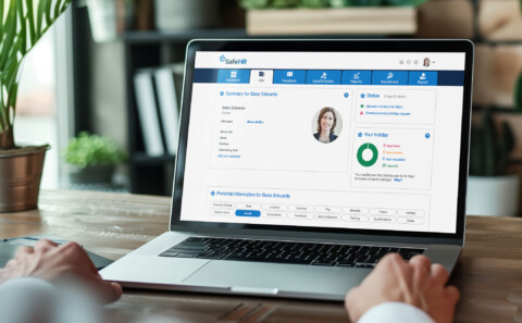 Laptop screen with SafeHR software's profile summary shown