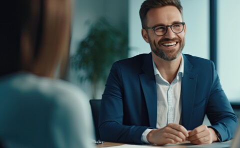 Happy employee smiling during meeting