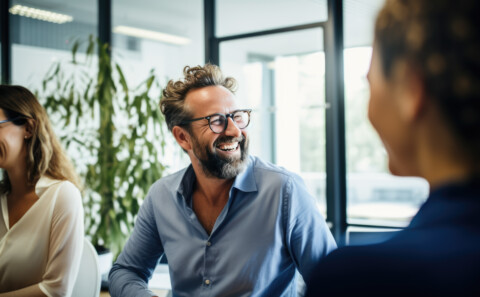 Employee smiling and looking away